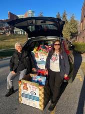 Sandy Mitchell, left, and Karen Reinersten with donations to Project Help’s Toy Drive. (Photos provided)