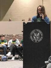 Charlie Hudson, a senior at Sussex Tech, suggests that the school board cut junior varsity sports rather than shops at a board meeting March 13. (Photo by Kathy Shwiff)