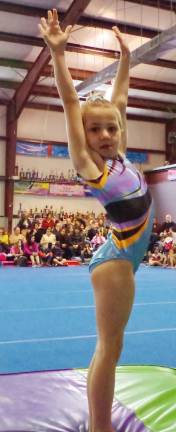 Westys gymnast Ryleigh Dayon presents after performing.