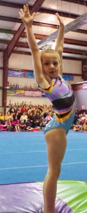 Westys hosts gymnastics meet Westys gymnast Ryleigh Dayon presents after performing.