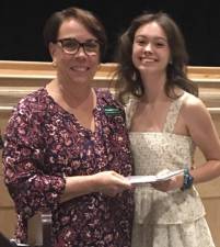 Grace Revoredo, a graduate of Sussex County Technical School, receives her scholarship from Vernon Township Woman’s Club member Rosemarie Guidice, left. (Photos provided)