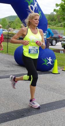 Placing fifth overall and the first female to cross the finish line was Catherine Stone.