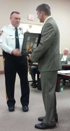 Vernon Police Chief Randy Mills honors Det. Sg.t. Sean Talt on his retirement on Monday.
