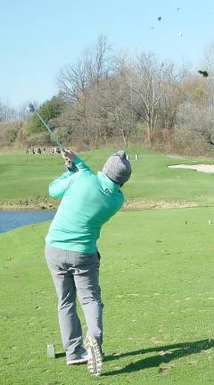 Tyler Borkowski of the winning Wild Turkey Team shows winning form on the par 3 11th hole.