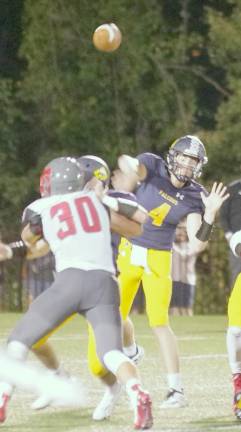 Jefferson quarterback Matthew Johnson (4) throws the ball towards a moving target in the second half. Johnson threw for 218 yards