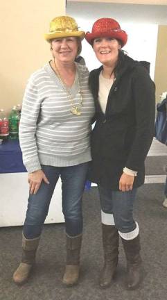 Church holds chili cookoff Maryann Bucsko and Josie Modracek with Best & Hottest Chili winners hats