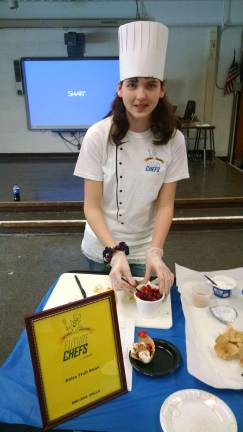 Melissa Valls is shown with her winning Salsa Fruit Bowl.