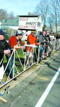 Locals finish strong at Boston Marathon Photo by Karl Fenske A spectator's sign.