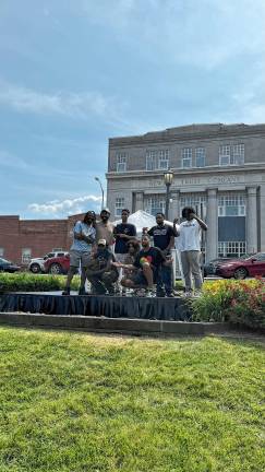 Juneteenth: Celebrating freedom and unity Juneteenth performers and organizers, top row from left, are Farrakhan Khaliq, True God, Lorant Mena and Samad Savage and, bottom row from left, True Prnc, Dollerie and Scott Paul. (Photo by Luke Rowe)