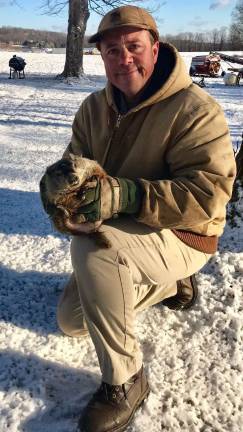 Local groundhog predicts long winter PHOTO BY LAURIE GORDON Parker Space is shown with the groundhog Stonewall Jackson V.