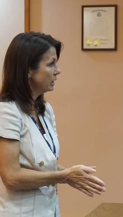 Photo by Vera Olinski JCP&amp;L representative Jacqueline Espinoza explains the importance of the new 231kV transmission line to the Wantage Committee.