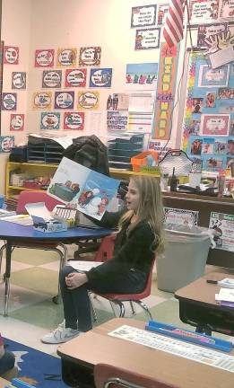 Lounsberry Hollow students read to younger children A fifth-grader from Lounsberry Hollow School in Vernon reads a holiday story to younger students.