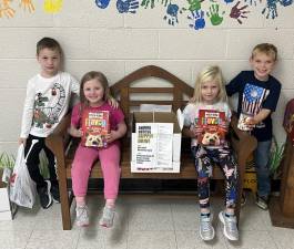 Kindergarten students from Mrs. Fryer and Ms. Roy’s class at the Clifton E. Lawrence School in Sussex helping to gather the supplies. From left to right are: Kevine Robine, Adrianna Gray, Olivia Roszkowski, and Logan Cosh.