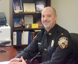 Vernon Township police chief Dan Young sits in his office.