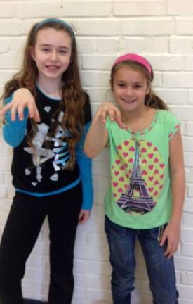 Determined mom brings back school's talent show Girls prepare to perform "Roar" by Katy Perry.
