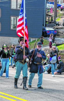 Tom Horuzy and Ed Biedricki of the 27th Regiment of New Jersey Volunteer Infantry Company F, a group of Civil War re-enactors, march in the parade.