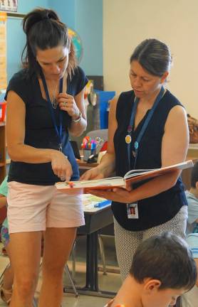 PHOTOS BY VERA OLINSKIFrom left, Kelly Talerico and Mary Ollert use the Fundations curriculum.