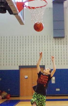 Matthew Herman, 12, of Stanhope, New Jersey shoots the ball.