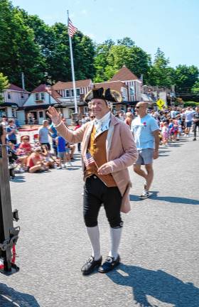 Sparta. Fourth of July events A member of Sparta’s RevolutionNJ 250 Committee marches in the parade.
