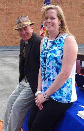 Special education teacher Kristie Lyons is shown with Lounsberry Hollow Middle School Principal Charles McKay in his temporary rooftop office.