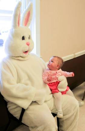 Zoey Rebecca Cosh of Wantage is not to sure about this Easter bunny at the Sussex Firehouse breakfast on Sunday.