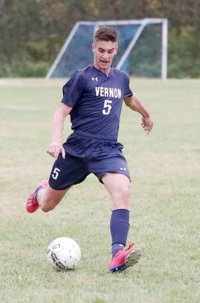 Vernon soccer player Gabriel Malec is about to kick the ball in the second period.