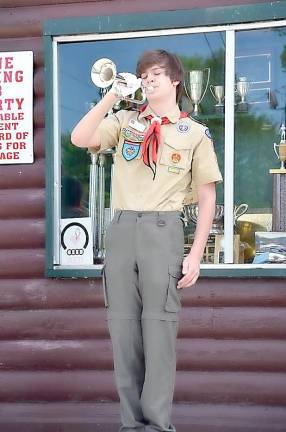 Vance of Troop 276 Byram plays Taps at the Cranberry Lake Ceremony.(Photo provided)