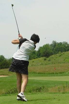Vernon resident hits hole-in-one Buffy Whiting shows the form that gained her a hole-in-one on the 2nd hole par 3 at the Wild Turkey Golf Cub