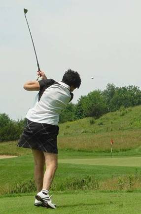 Buffy Whiting shows the form that gained her a hole-in-one on the 2nd hole par 3 at the Wild Turkey Golf Cub