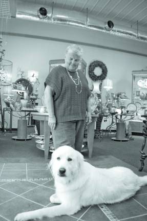 Handcrafted elegance comes to Hardyston Photos by CHris Wyman Quincy, the Chief Security Officer at Silken Wool Home, relaxes on the floor next to employee Chris Risano.