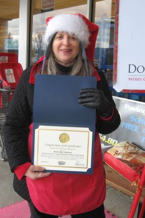 PHOTO BY JANET REDYKEMary Ellen Vichiconti, who mans the Salvation Army Christmas donation pot out front of the Vernon Acme, proudly displays her 2017 Hometown Hero Award.