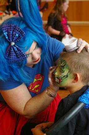 Dominic DeCroce, 7, is transmogrified into a &#xfe;&#xc4;&#xfa;Monster&#xfe;&#xc4;&#xf9; by Pixie Pop the Clown, Kerry Tobin of Highland Lakes.