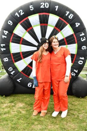 Vernon holds trick or trail event <b>Deanna Young and Ava Schlenker are shown in front of an inflatable dart board.</b>