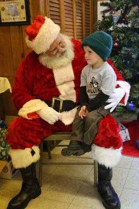 American Legion hosts lunch with Santa Easton Haggerty tries to remember everything on his Christmas list for Santa.