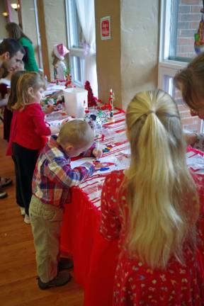Barry Lakes hosts Breakfast with Santa Hard at work at the childrenís craft table.