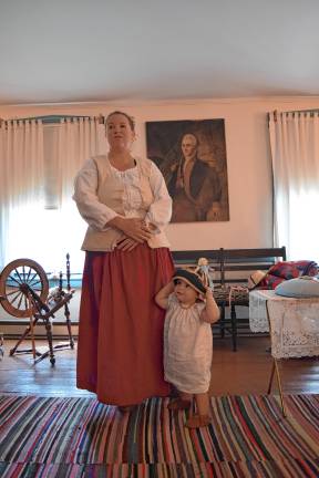 A trip back in time <b>Museum curator Ashley Ziccardi with her daughter, Reagan, 1, wearing a pudding cap.</b>