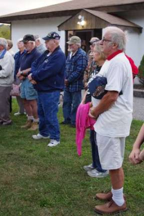 Bernhard Oesen and his wife, Carol, of Wantage listen as the memorial is dedicated.