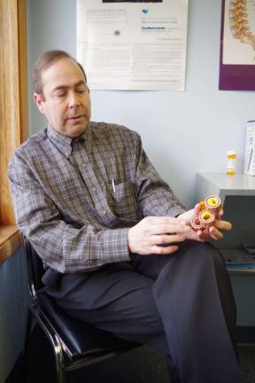 Unique specialty comes to Vernon In his downtown Vernon offices, Dr. Blair Beltzer describes the various stages of cardiovascular disease and atherosclerosis with the help of a device that shows the early and advanced stages of the disease in an artery.