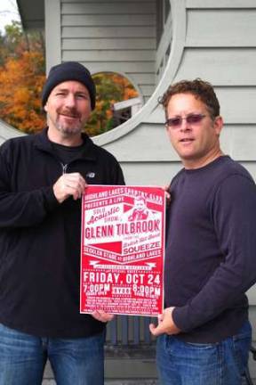 Photos by Chris Wyman Highland Lakes residents Randy Staley (left) and Michael Gelfand are shown outside the clubhouse with a poster announcing the upcoming Oct. 24 live concert starring Glenn Tilbrook of the British hit band Squeeze.