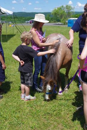 PHOTOS BY CHRIS WYMAN Elizabeth Neillands of Vernon&#xed;s Pond Hollow Stables brought two ponies to the camporee and went into great detail about equines and how to properly treat them.
