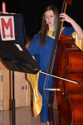Vernon students inducted into music honor society Hannah Lowery on string bass.