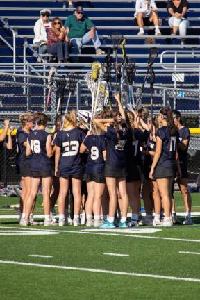 The Vernon Vikings raise their sticks during a time-out huddle in the first round.