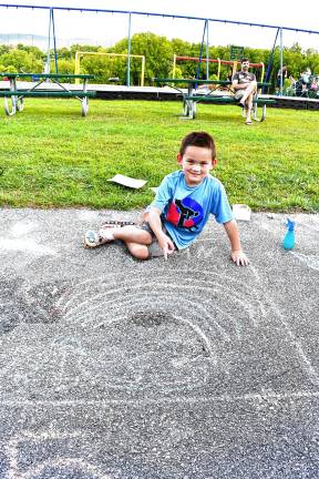 Photos: Sidewalk Chalk Art Festival in Vernon <b>Connor Naughton of Vernon with his chalk drawing.</b>
