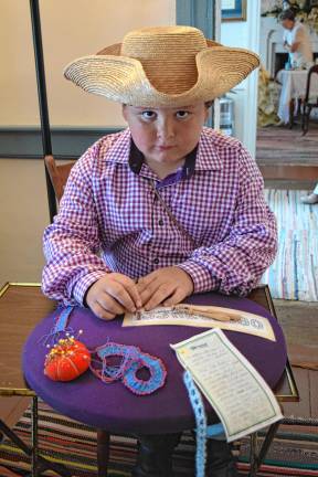 A trip back in time <b>Heath Ziccardi, 10, makes numbers of bobbin lace.</b>