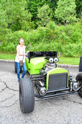 Photos: 2nd annual Car Show in Vernon <b>Carmen Reyes poses next to a car on display.</b>