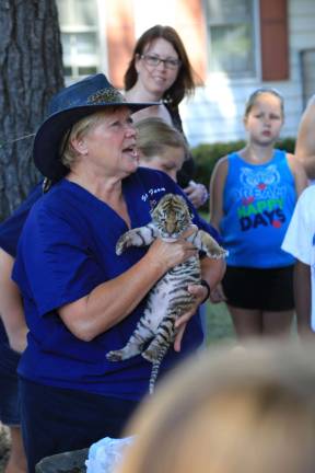 Zoo Mama Lori Space Day with eleven day old Tiger cub on Junior Zookeepers Day.