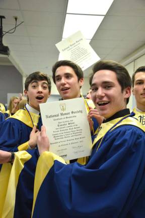 Connor Quin revels in the recognition with friends, and twin brothers, Brendan and Timothy Shine.
