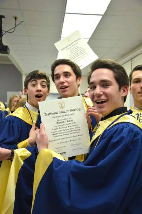 Vernon inducts new National Honor Society members Connor Quin revels in the recognition with friends, and twin brothers, Brendan and Timothy Shine.