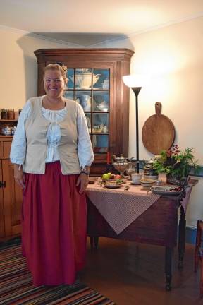 A trip back in time <b>Museum curator Ashley Ziccardi tells visitors about the keeping room.</b>