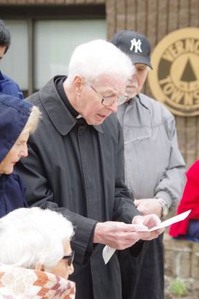 Monsignor Robert Carroll of Our Lady of Fatima Church in Highland Lakes is shown reading a prayer. Father Bob will be retiring from the ministry in June.